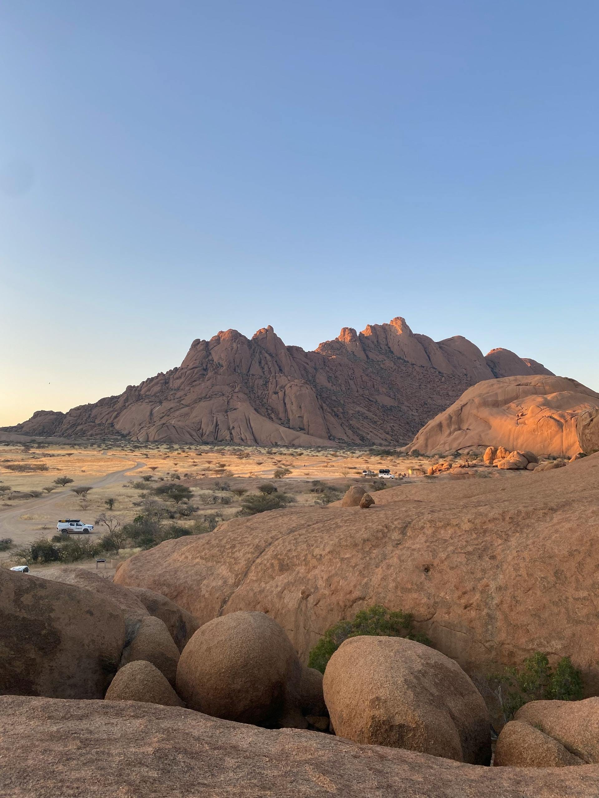 Stunning rocky landscape at sunset in Erongo Region, Namibia, showcasing dramatic boulders and natural beauty.